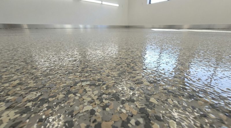 Healthcare floor with flake broadcast finish and stainless cove base detail