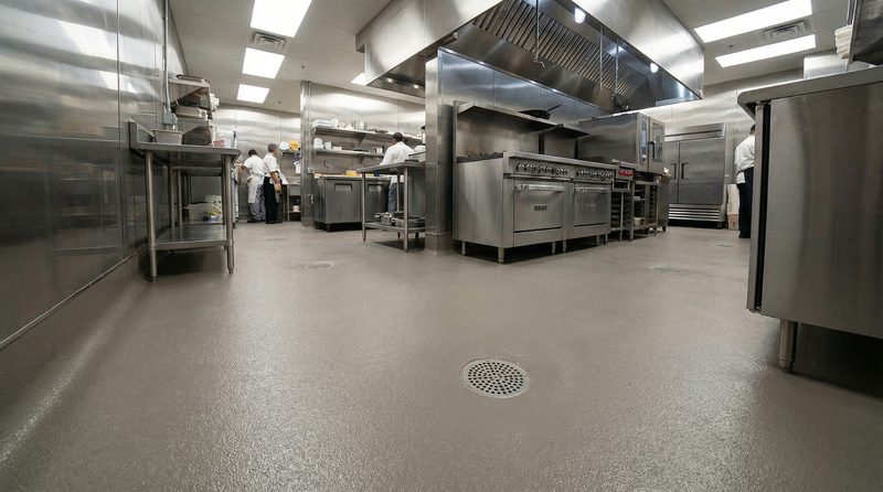 Commercial kitchen with seamless quartz-broadcast urethane cement floor and floor drains